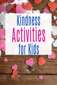 the words kindness activities for kids surrounded by hearts on a wooden table with pink and white confetti