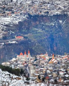 an aerial view of a city in the snow