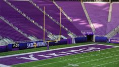 an empty football stadium with purple seats