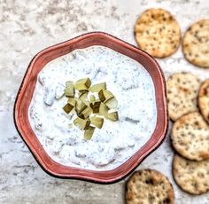 crackers and dip in a bowl on a table