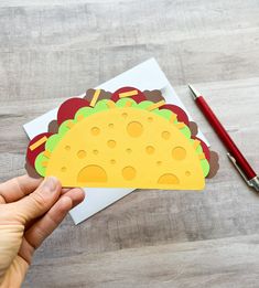 This taco shaped gift card holder makes the perfect gift for the foodie in your life!  The card is shaped like a taco.  The opens up so you can add your gift card inside.  It comes with an envelope and lies flat to be mailed.   **Gift card NOT included** All orders over $35 ship FREE! Please see other gift card holders and cards at https://thesunnypaperstudio.etsy.com This gift card holder will be mailed to you in a plastic sleeve and an envelope or box, depending on the size of your order. Dimensions: Approximately 7 inches tall and 5 inches wide (at the top).  It comes with an A7 envelope. Taco Card Ideas, Restaurant Gift Card, Gif Card, Birthday Gift Card Holder, Taco Gifts, Birthday Gift Card, Restaurant Gift Cards, Mexican Gifts, Gift Card Holders