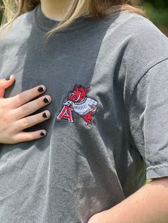 Confort Colors embroidered vintage Arkansas razorback shirt Casual Embroidered Tops For College, Casual Tops With Custom Embroidery For College, Embroidered Cotton Tops For College, Vintage Embroidered Cotton T-shirt, Casual Tops With Embroidered Patch For Spring, Casual Spring Tops With Embroidered Patch, Embroidered Short Sleeve College T-shirt, College Embroidered Short Sleeve T-shirt, Embroidered Short Sleeve T-shirt For College