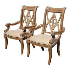 two wooden chairs sitting next to each other