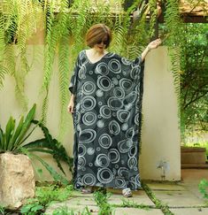 "A soft, comfy, printed light rayon maxi kaftan. A must have piece for this summer. Team this dress with sandal and a big tote to complete a casual chic, or wear it to a garden party, Sunday brunch and beach party. Material: printed light rayon Model is 161 cm. tall with 32\" bust, 28\" waist and 38\" hip Status: ready to ship weight: 315g Measurement: dress (approximately) Width: 43.5\" Bust: 65\" **can fit up to bust max 52\" Hip: 65\" **can fit up to bust max 52\" Length: 52.5\" PLEASE PROVID Printed Black Maxi Dress For Beach Season, Casual Black Printed Beach Dress, Black Printed Maxi Dress Free Size, Black Free-size Kaftan For Spring, Casual Black Maxi Kaftan, Black Free Size Casual Kaftan, Printed Black Kaftan For Beach, Black Bohemian Printed Beach Dress, Casual Black Tunic Beach Dress