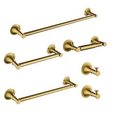 four brass colored towel bars on a white background