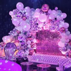 an elaborately decorated stage with balloons and lights