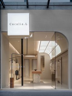 the entrance to a clothing store with glass doors