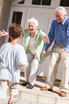 an older man and young boy playing outside their home with the text, what are the benefits of having a granny flat in your home?