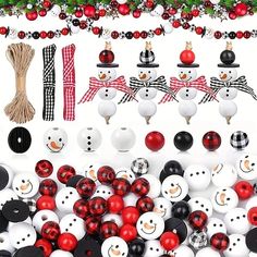 christmas decorations and ornaments are arranged on the table with balls, garlands and snowmen