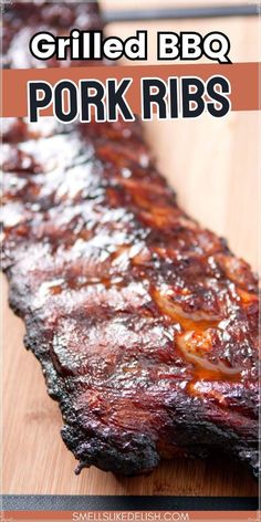 grilled bbq pork ribs on a cutting board with text overlay that reads grilled bbq pork ribs