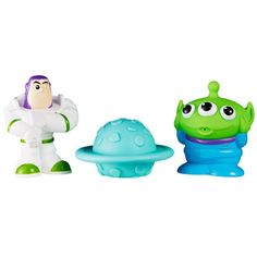 three toy figurines in the shape of aliens