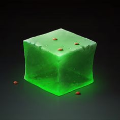 a green cube with gold dots sitting on top of it's sides, in front of a black background