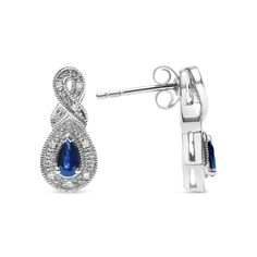 Prepare to dazzle in these stunning sapphire and diamond drop stud earrings, crafted from .925 sterling silver. Featuring two natural pear-shaped blue sapphires, each measuring 4.5 x 3mm, and accented by 14 round-cut natural diamonds, these earrings exude elegance and sophistication. The intricate prong setting of the gemstones ensures maximum light exposure, illuminating the deep blue hues of the sapphires and the sparkling fire of the diamonds. The diamond count of 14 and total weight of 0.05 Elegant Sapphire Diamond Earrings For Anniversary, Elegant Sapphire Diamond Earrings With Accents, Elegant White Gold Diamond Earrings With Birthstone, White Gold Teardrop Gemstone Diamond Earrings, Elegant Formal Diamond Earrings With Birthstone, Elegant Earrings With Diamond Accents And Lab-created Sapphire, Sapphire Sterling Silver Pear-shaped Earrings, Sapphire Pear-shaped Sterling Silver Earrings, Elegant Diamond Birthstone Earrings