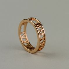 Perfect for weddings, engagements and anniversaries, this custom roman numeral text ring is completely personalized with whatever text, date, number or symbol you want. How to Order: Chose your Material and Size preferences from the drop-down menus and add item to cart. On the Checkout page, you will see a Notes to Seller box where you can leave me a note about the text/date/symbols you want. Want this with diamonds or other gemstones? - Eternity Stlye 1: http://etsy.me/1M4eRBc - Eternity Style Roman Numeral Ring, Gold Earrings Indian, Unique Symbols, Witchy Jewelry, Roman Numeral, Celtic Jewelry, Roman Numerals, Ring Collections, Gold Bangles