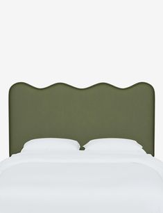 an upholstered headboard for a bed with white sheets and pillows on it