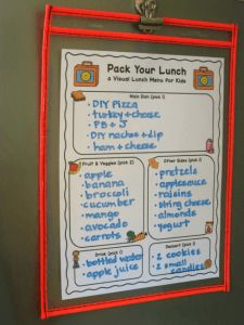 the back of a lunch menu hanging on a wall with an orange frame around it