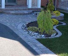 a brick patio in front of a house