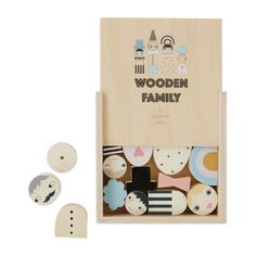 wooden toys in a box with the words wooden family written on it and four different shapes