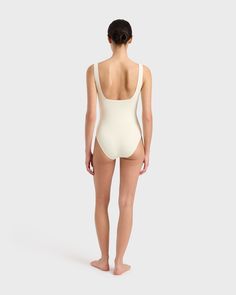 Margot one piece in Porcelain is a timeless classic swimsuit has an elegant square neckline front and back and invisible under-bust support. Self-lined in our ultra-soft Embodee™ fabric that has high shaping power, gently holding, shaping and enhancing the silhouette. To ensure the garment is opaque when wet, the front of the suit is a triple layer. A beautiful, classic one piece that will show off your summer tan and in a soft, matte fabric works perfectly as a body suit worn under skirts, shor Elegant Square Neck Stretch Swimwear, Elegant Stretch Swimwear With Scoop Neck, Elegant Scoop Neck Stretch Swimwear, Elegant Stretch Scoop Neck Swimwear, Square Neck Lined Swimwear With Elastane, Square Neck Lined Swimwear, Second-skin Scoop Neck Shapewear Swimwear, Square Neck Second-skin Swimwear, Chic Seamless Square Neck Swimwear