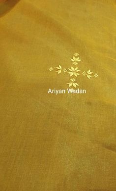 an embroidered yellow cloth with the name arjvan wadan written on it in white