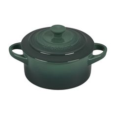 a green casserole dish with a lid