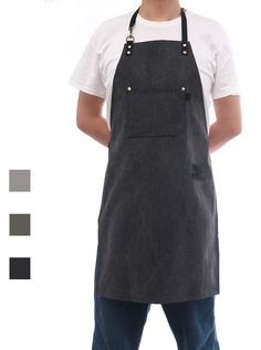 a man standing with his hands on his hips wearing an apron and overalls, while looking at the camera