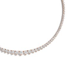 Designed with comfort in mind, the 18 Carat Graduated Tennis Necklace is handmade to be fluid, not rigid, allowing it movement for comfortable wear. It features prong-set brilliant round diamonds ascending in size as it reaches the center of the necklace. Rose Gold Diamond Tennis Necklace For Anniversary, Rose Gold Diamond Tennis Necklace For Formal Occasions, Rose Gold Brilliant Cut Tennis Necklace For Anniversary, Classic Rose Gold Diamond Necklace With Round Cut, Anniversary Rose Gold Brilliant Cut Tennis Necklace, Classic Rose Gold Necklace With Diamond Accents, Timeless Rose Gold Diamond Necklace With Round Cut, Anniversary Rose Gold Diamond Tennis Necklace, Formal Rose Gold Diamond Tennis Necklace