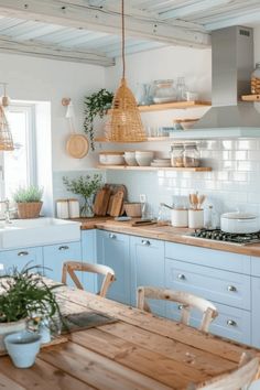 a kitchen filled with lots of wooden furniture next to a sink and stove top oven