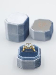 The Mrs. Box Heirloom Velvet Engagement Ring Box  Shop Heirloom Velvet Engagement and Wedding Ring Boxes  Meet the modern wedding heirloom, The Mrs. Box. Choose from 44 colors and countless personalized options to design your perfect match.  #weddingplanning #bridesmaids #gifts #wedding #engagement #ring #velvet #custom #flatlay #styling #photography #ringbox #themrsbox  https://themrsbox.com/  The Truman Bevel Single Light Blue Velvet, Heirloom Ring, Ship Captain, Heirloom Rings, Reflecting Light, Ring Boxes, Velvet Ring Box, Polish Silver, Monogram Styles