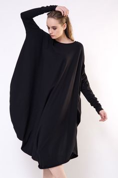 This loose and cosy black dress will help you to forget those 'nothing to wear' days.  Features + Modern asymmetrical slantwise cut + Wide loose comfortable fit + Light and dynamic look + High quality viscose  + Modern prolonged sleeves + Raw lower edge Please check the actual size measurements before purchasing. Model is 175cm/5'9" and is wearing size S. HERE IS THE SIZE GUIDE: XS Bust: INCHES 32 - 34  //  CENTIMETERS 80 - 85 Waist: INCHES 23.2 - 26  //  CENTIMETERS 58 - 65 Hips: INCHES 34.4 - Long Sleeve Dress Casual, Sleeve Dress Casual, Jersey Dresses, Long Sleeve Casual Dress, Gift For Mother, Dress Cotton, Designer Dress, Dress Gift, Draped Dress