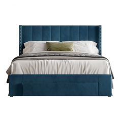 a bed with blue upholstered headboard and foot board