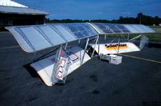 an airplane with solar panels attached to it