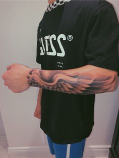 a man with a tattoo on his arm