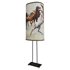 a lamp that has a horse on it with a light shade in the shape of a lampshade