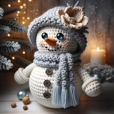 a crocheted snowman with a hat and scarf