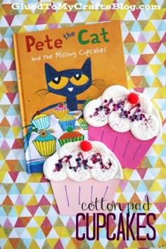 the book pete the cat and the missing cupcakes is laying next to it