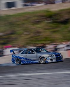 a car driving on a race track during the day