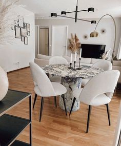 a dining room table with chairs around it