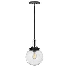 a light fixture with a glass globe hanging from it's end, on a white background