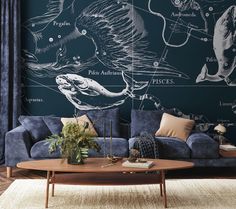 a living room filled with furniture and walls covered in astrologicals on the wall