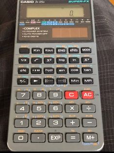 a calculator sitting on top of a couch