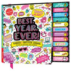 the best year ever creative journal planner is shown in pink and blue, with colorful stickers on it