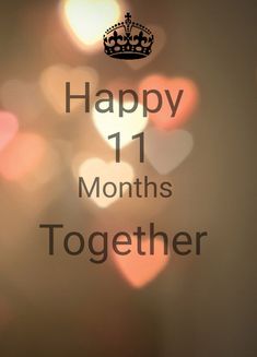 the words happy 11 months together written on a blurry background with boke lights