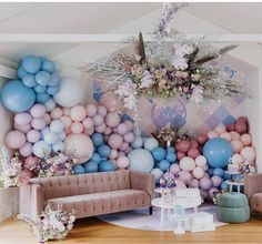 a living room decorated with balloons and flowers