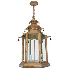 a hanging lantern with three candles in it