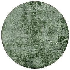 a round area rug in green with trees on it