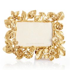 an ornate gold frame with flowers and leaves on the edges is shown in front of a white background