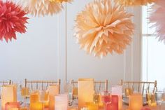 the table is set up with paper pom - poms