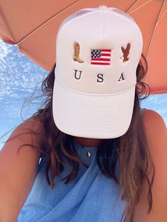 Celebrate the 4th of July in style with our Embroidered USA Icons Trucker Hat. This custom hat features classic country and western designs, perfect for any cowboy or cowgirl. Made with a mesh back for breathability. Add a touch of Americana to any outfit with this must-have accessory! This design is protected under intellectual property copyright. Art that is created is safeguarded by intellectual property copyright and is owned by the artist. We hand-drew this and had it digitized. Features: S Patriotic White Hat For Summer, Casual White Baseball Cap For 4th Of July, Adjustable White Hat For 4th Of July, White Patriotic Adjustable Trucker Hat, White Baseball Cap For 4th Of July, White Americana Hat With Adjustable Fit, White Curved Brim Baseball Cap For 4th Of July, Americana Style Adjustable Baseball Cap, Trendy Cap For 4th Of July