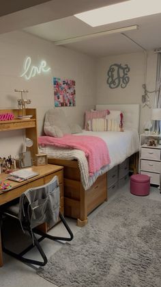 a bedroom with a bed and desk in it